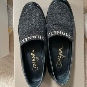 CHANEL Black and Gold Slip-On Patent Loafers